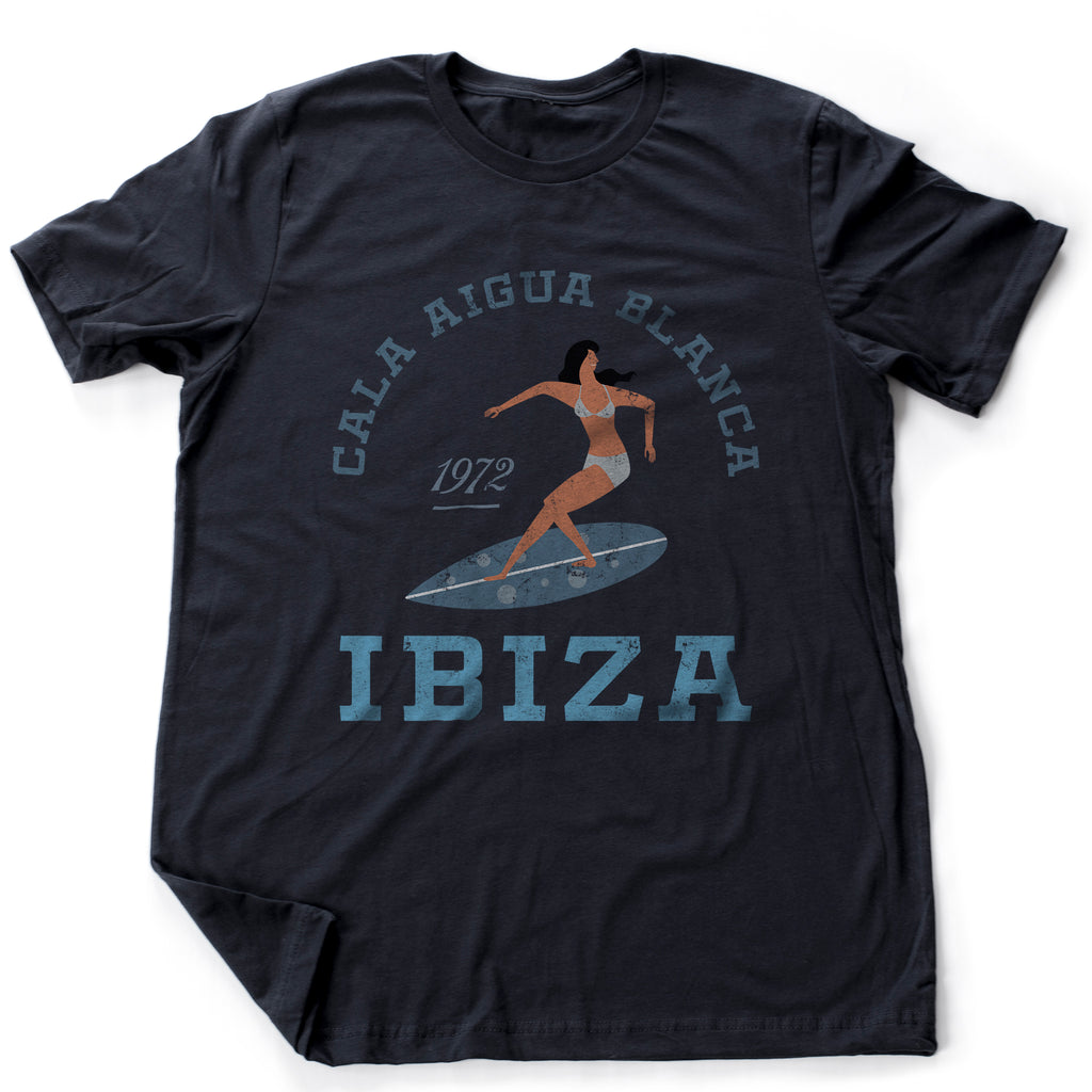 Beautiful retro, vintage-inspired graphic t-shirt featuring a female SURFER in the Cala Aigua Blanca area of Ibiza, Spain.
