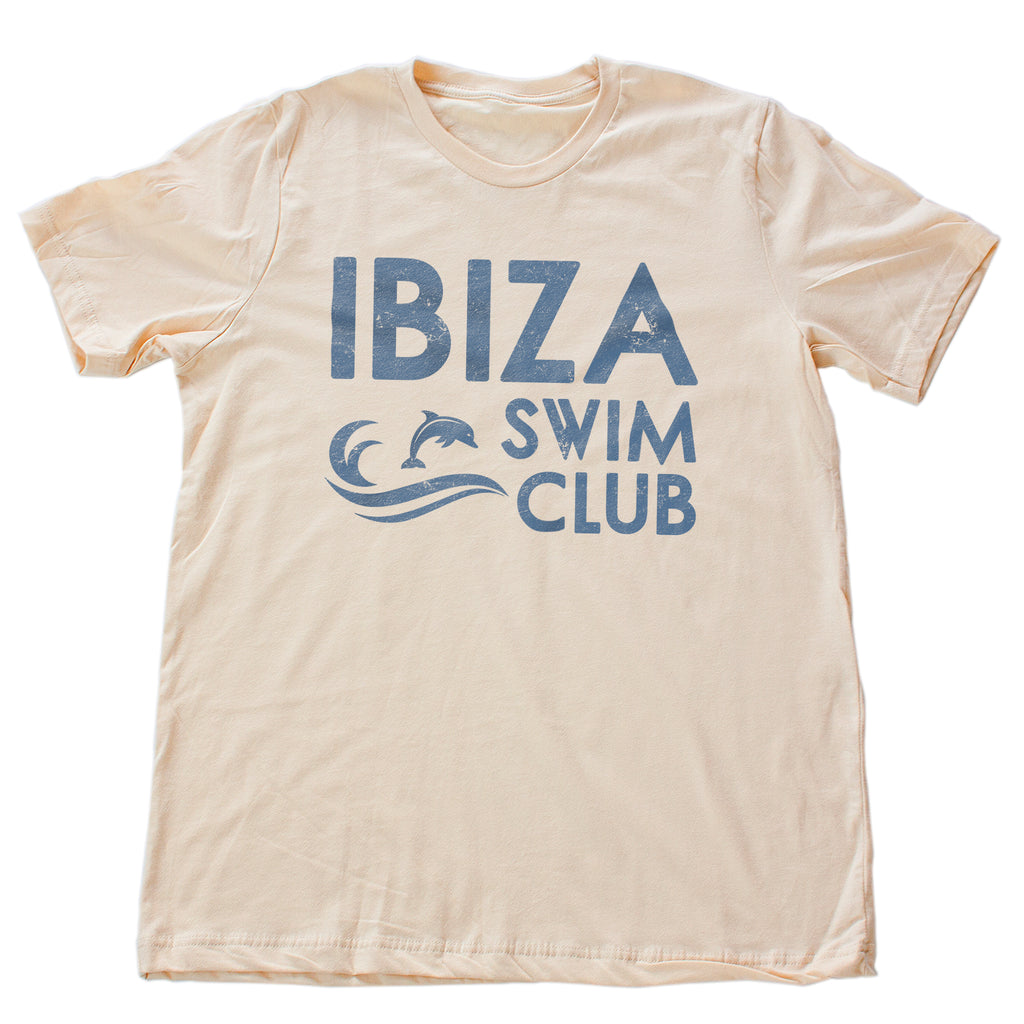 Vintage-inspired, retro graphic t-shirt for the fictional Ibiza Swim Club, featuring a wave and jumping Dolphin, for swimmers, surfers, beach lovers.