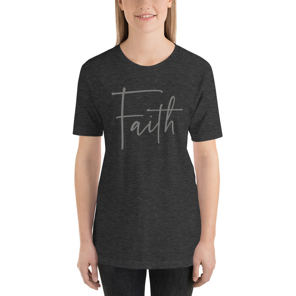 An elegant graphic t-shirt with the inspirational word Faith in handwritten script.