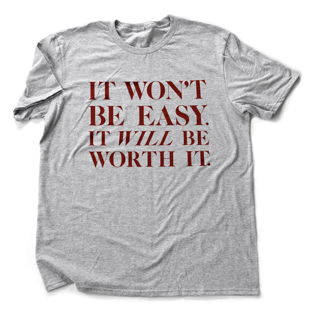 Inspirational, motivational graphic t-shirt with the words "It won't be easy. It will be worth it" in classic typography.