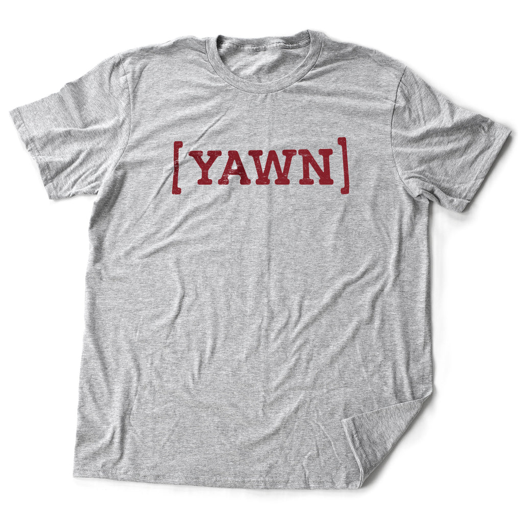 A sarcastic graphic t-shirt proclaiming the user as too bored to give a damn, with the parenthetical "YAWN" in bold typography.