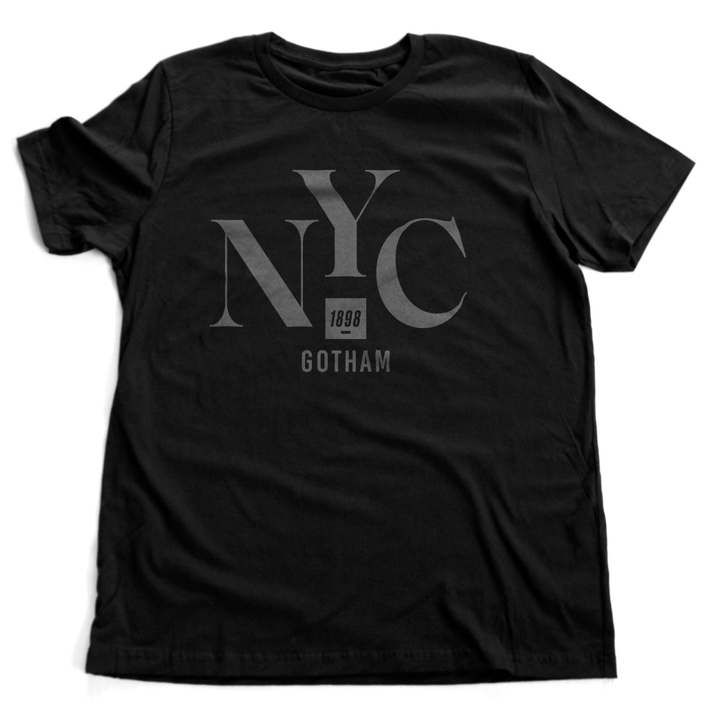 Fashion graphic t-shirt honoring New York City / Gotham, with the elegant typography that reads "NYC" and "Gotham" with the year of New York City's founding, 1898 within a smaller block.