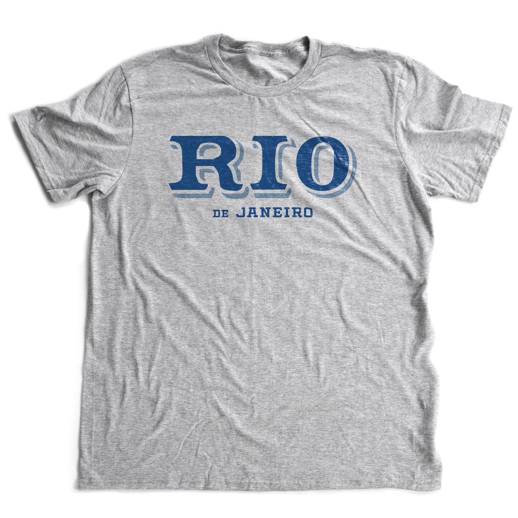 Retro design graphic t-shirt featuring bold typography of "RIO" in a shadow font, with "de Janeiro" below.