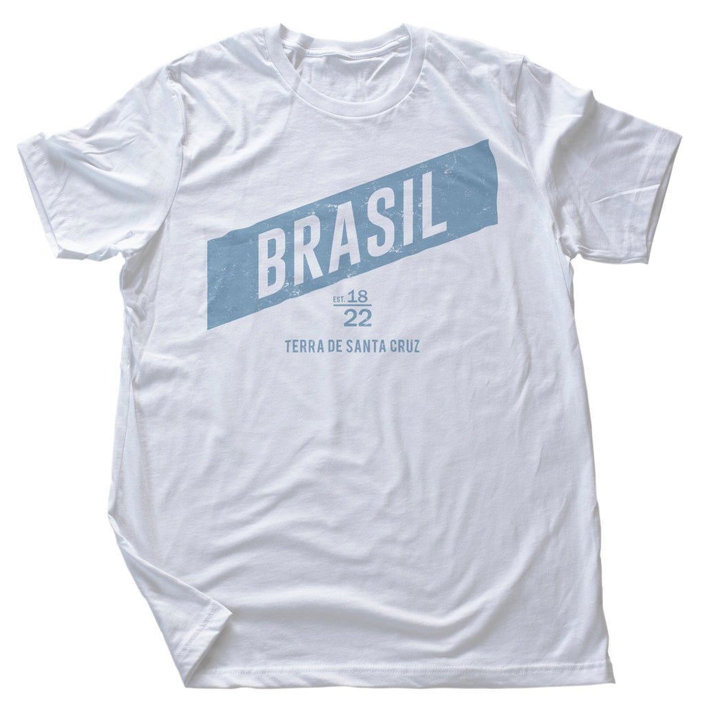 Vintage, retro-styled graphic t-shirt featuring "BRASIL" in a diagonal band, and the year 1822 commemorating the country's establishment, plus its nickname "terra de santa cruz"