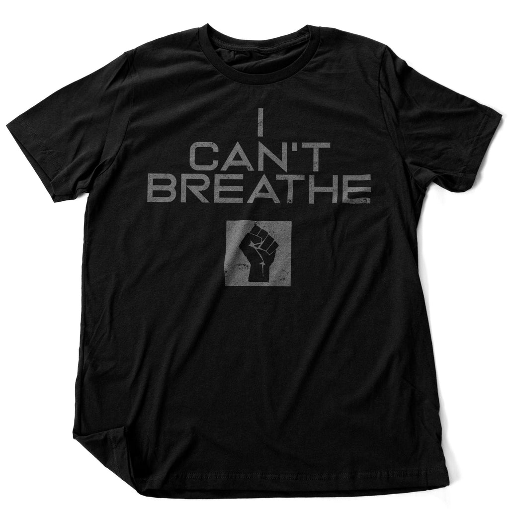 Graphic t-shirt featuring the powerful graphic of a raised fist, and George Floyd's last words, "I Can't Breathe" to honor the Black Lives Matter movement in 2020.