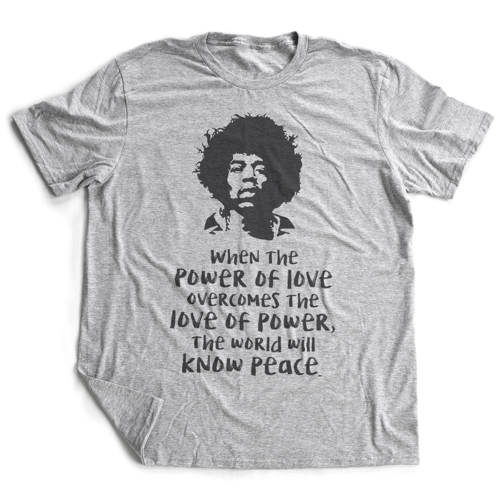 A classic, retro-style graphic t-shirt featuring a illustration of the iconic Jimi Hendrix, and a quote "When the power of love overcomes the lover of Power, the world will know peace."