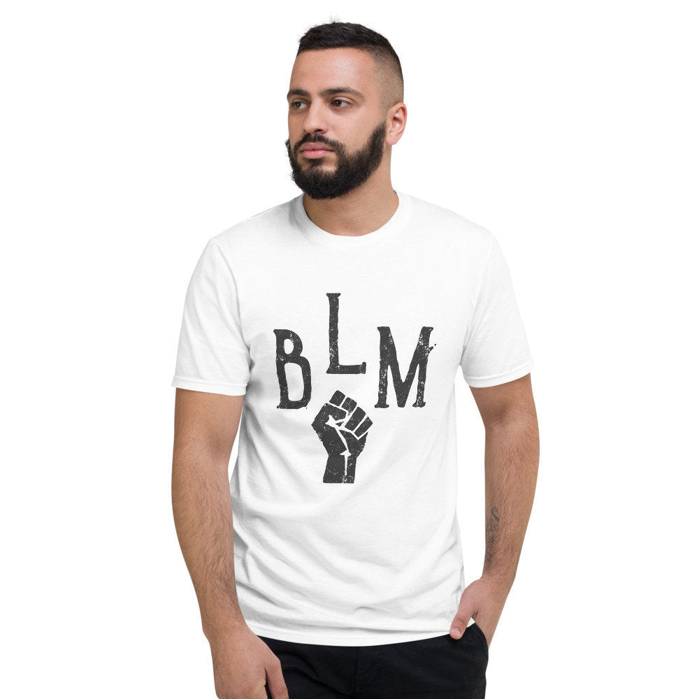 Retro inspired graphic t-shirt to honor the Black Lives Movement, with an iconic black FIST image, with "BLM" in an arc above it.