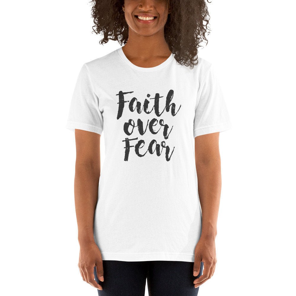 Elegant graphic t-shirt featuring the inspirational words "Faith over Fear." 
