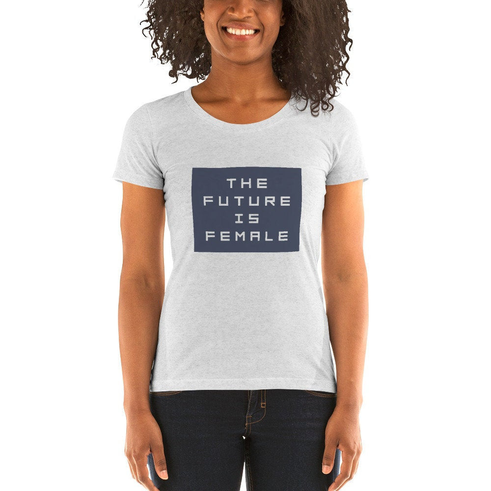 Female model wearing a classic, elegant graphic t-shirt with the words "the future is female" within a solid block.